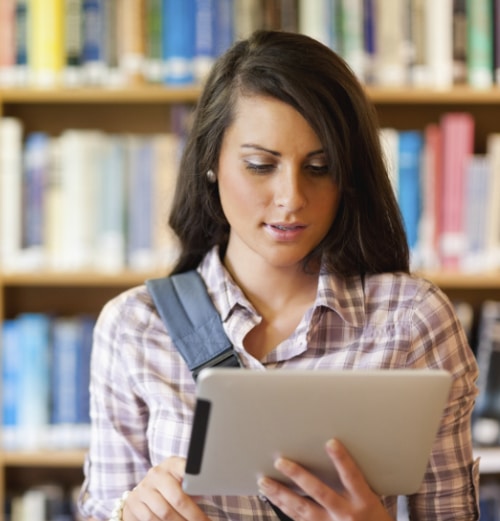 Young focused student using a tablet computer Acellus Academy for Independent Study